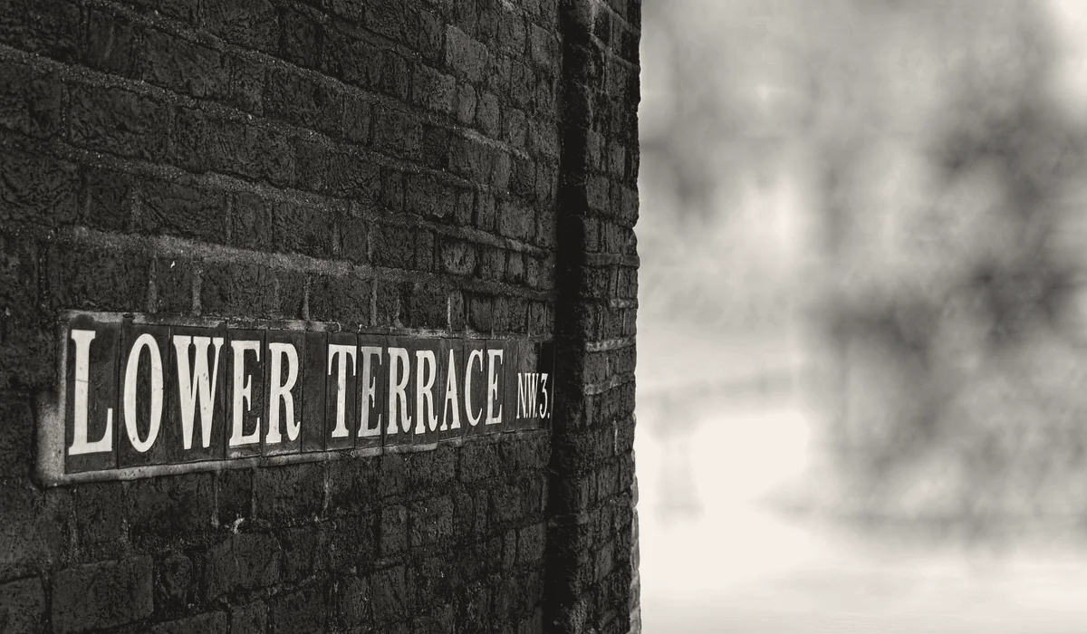 A London street sign on a brick wall.