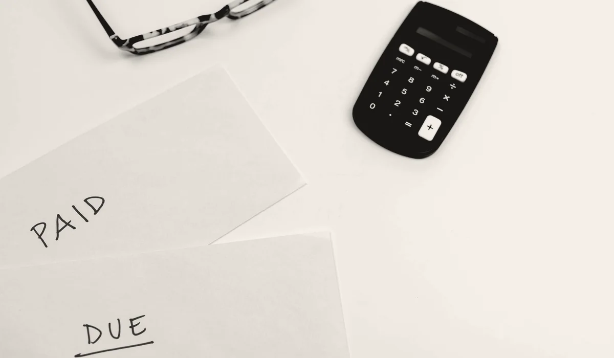 An invoice and a calculator.