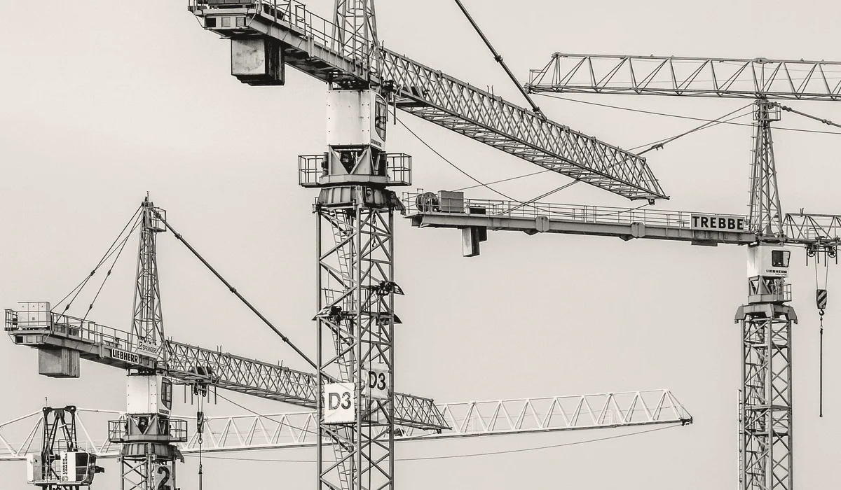 A crane lifting a load on a construction site.
