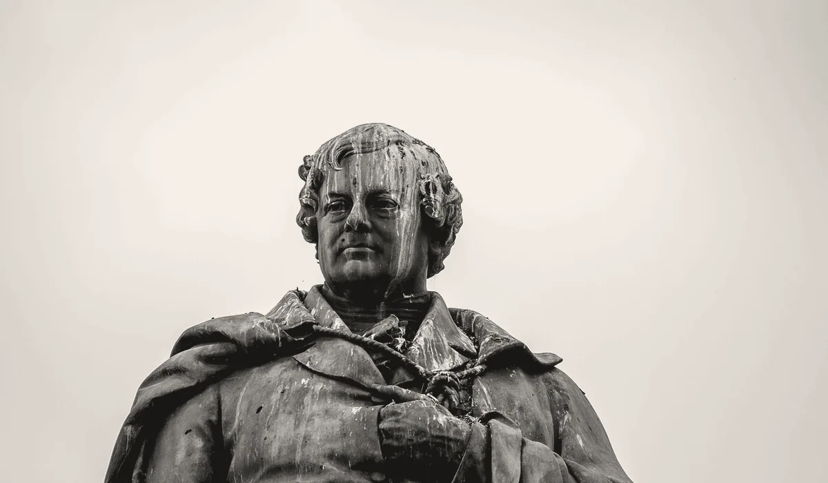 The weathered surface of a bronze figure.