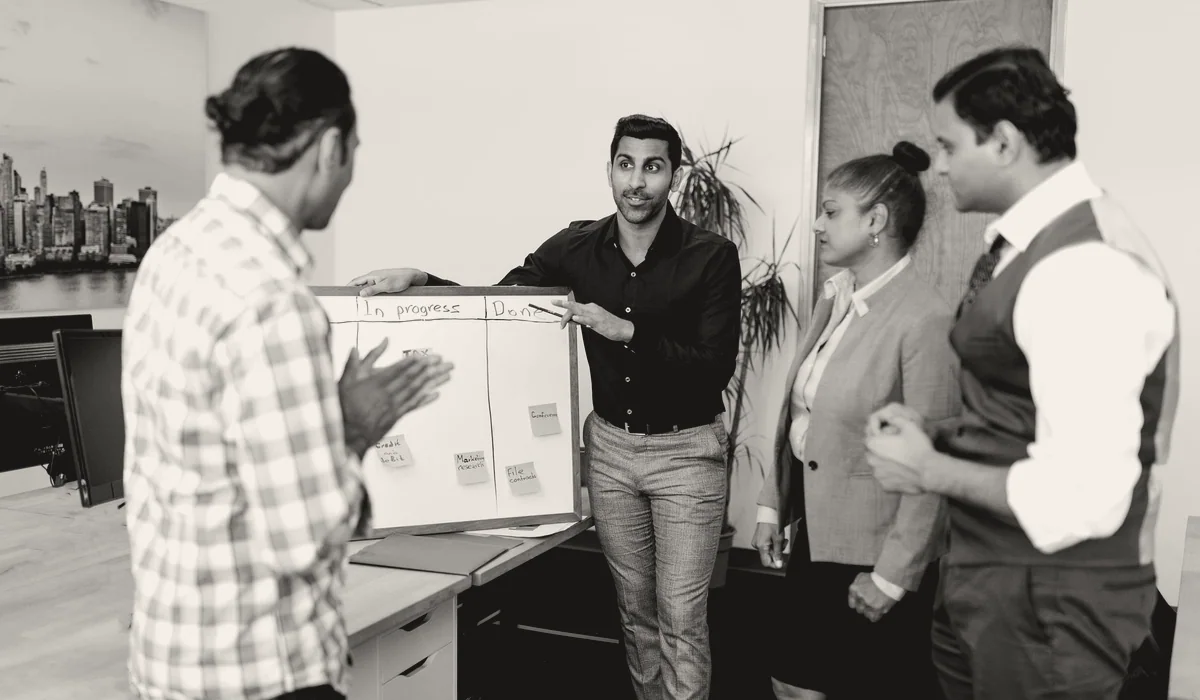 A team in discussion around a meeting table.